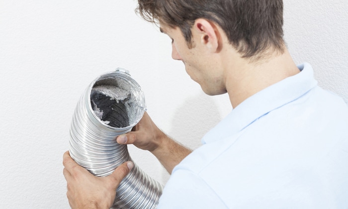 Tech Looking Into Dryer Vent Hose